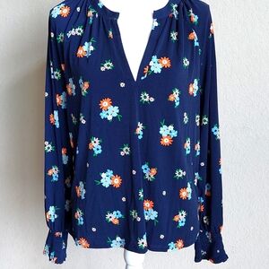 Navy blue long sleeve loose fitting v- neck shirt.